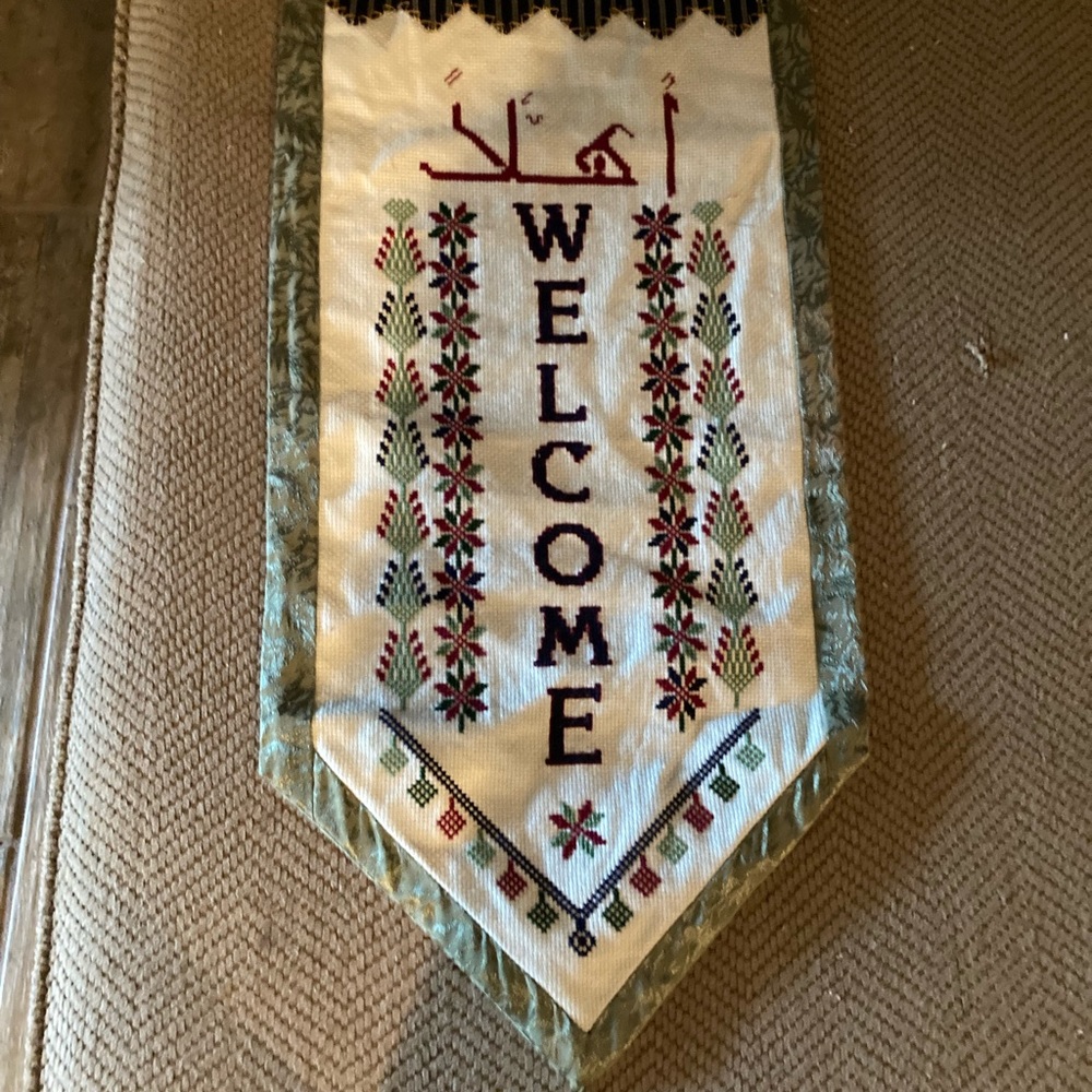 A Cross-stitch Welcome Hanging piece.